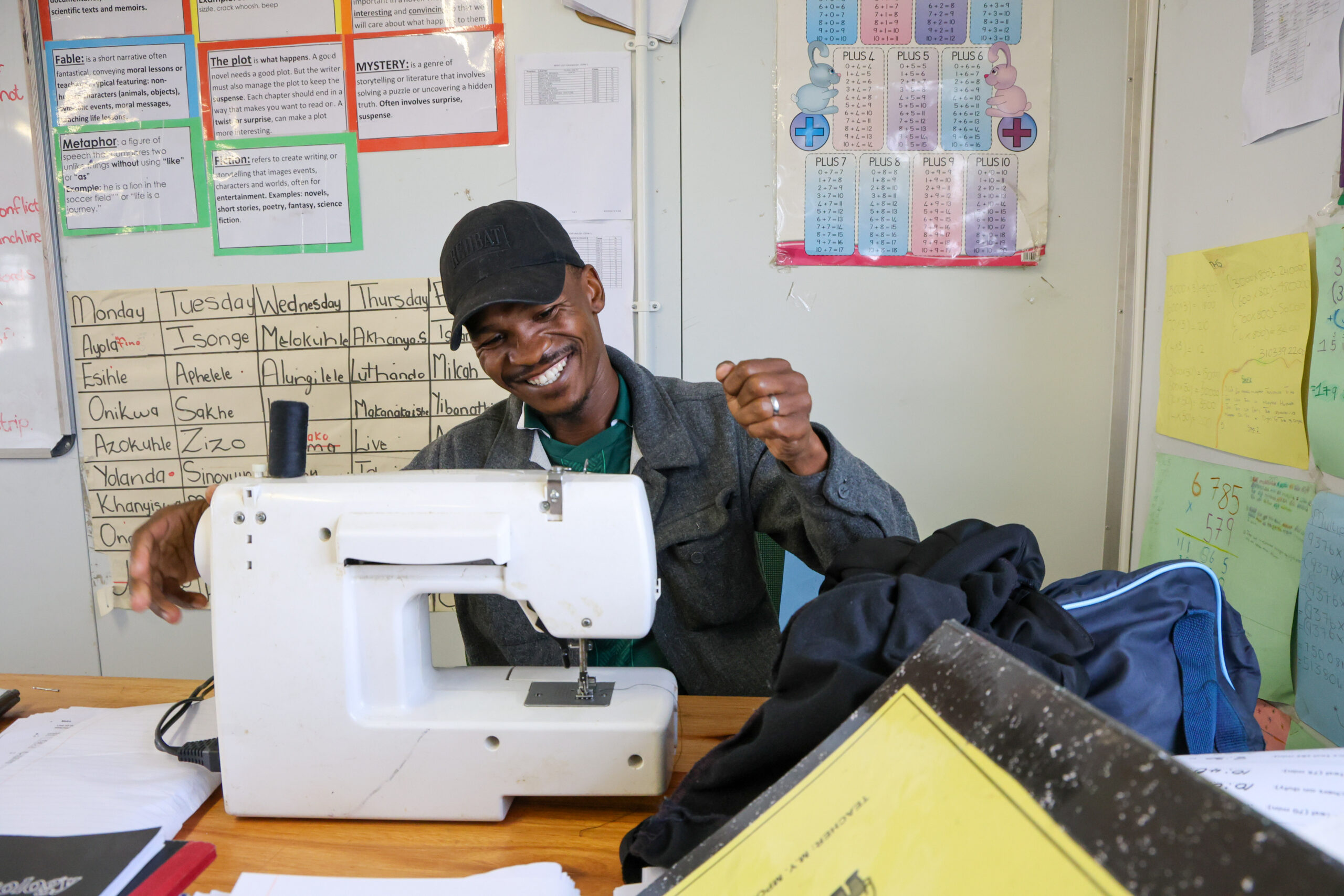 Sonwabile Gana repairs torn uniforms for learners at Witsand Primary School in Atlantis. Photo: Shelley Christians/EdDesk